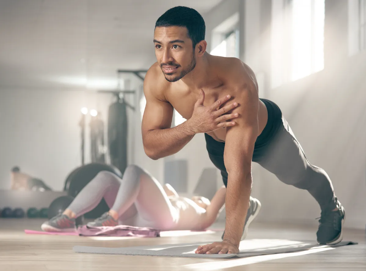 fit man doing push up at the gym utc