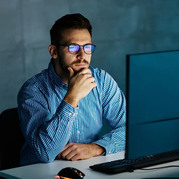 man looking in monitor