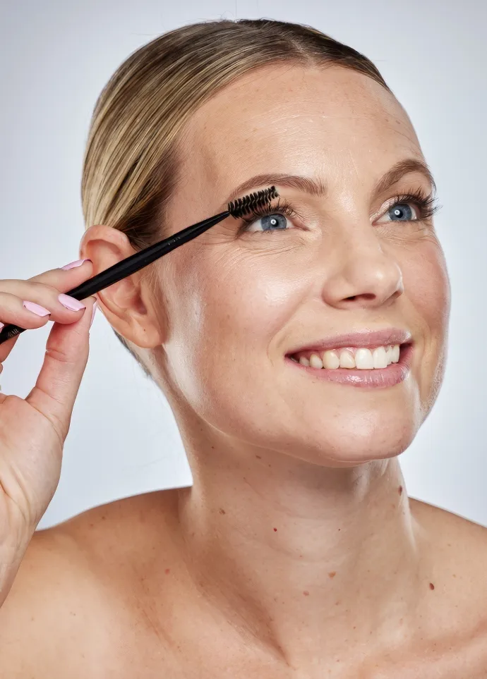cosmetics woman and mascara brush with smile cas utc