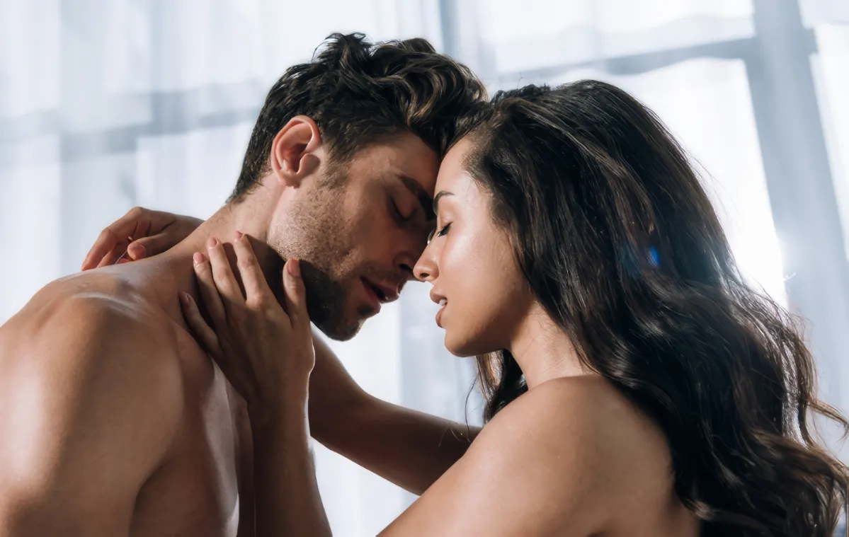 handsome man and sexy woman embracing with closed utc