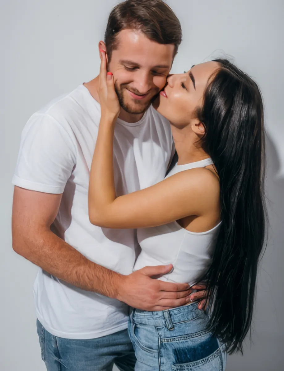 happy young man and girl hugging and kissing with utc