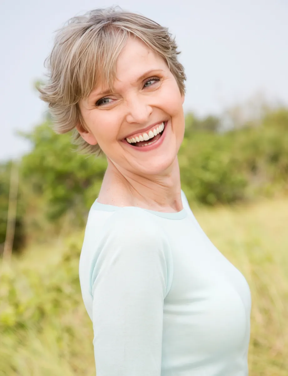 portrait of a smiling senior woman in a tropical d utc