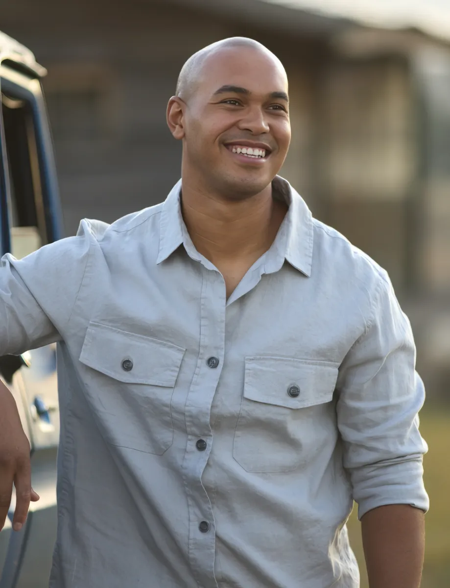 portrait of man with pick up truck on road trip to utc
