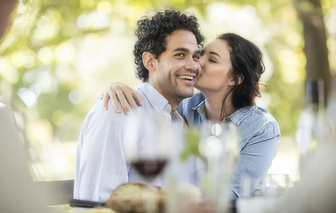 romantic couple embracing woman kissing man s che utc