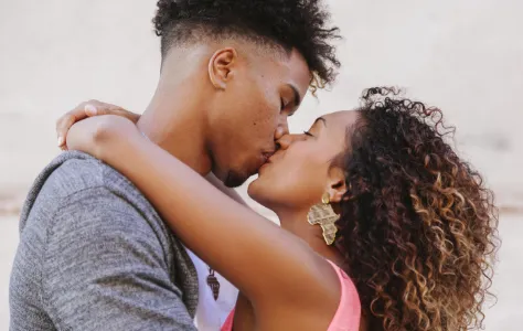 young couple embracing in romantic close up utc